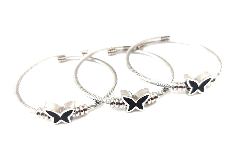 TRIO DE PULSERAS DE TENSOR EN STAINLESS STEEL CON MARIPOSAS NEGRAS