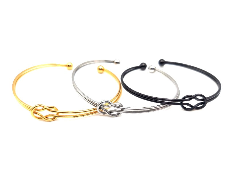 TRIO DE PULSERAS EN STAINLESS STEEL DORADO PLATEADO Y NEGRO
