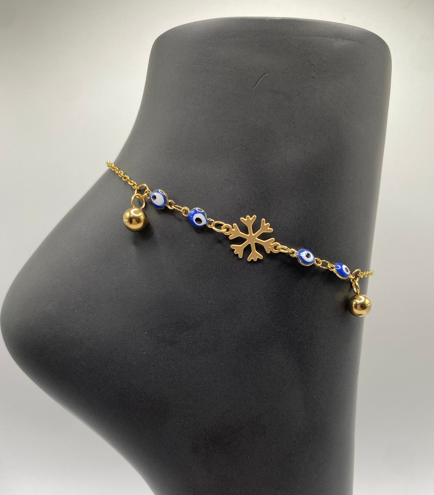 TOBILLERA EN STAINLESS STEEL DORADO DE OJO TURCO AZUL CON COPO DE NIEVE 10"