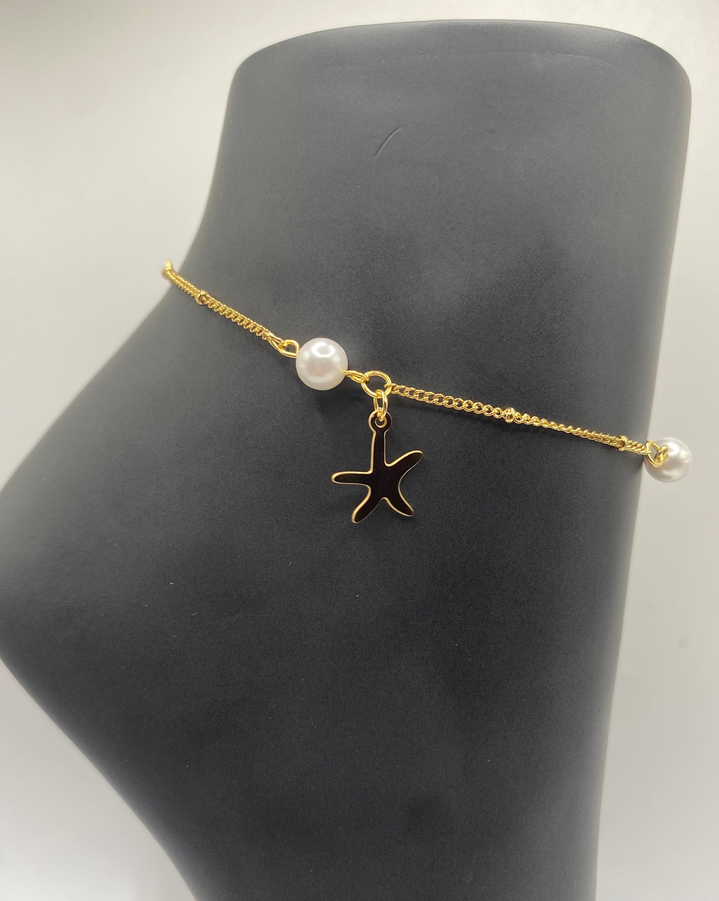 TOBILLERA EN STAINLESS STEEL DORADO CON ESTRELLA Y PERLA 10"