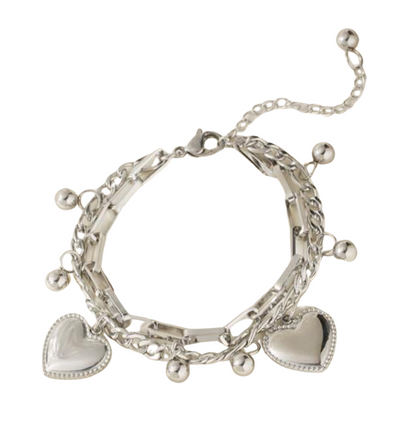 PULSERA EN FASHION STEEL PLATEADO CON CORAZONES
